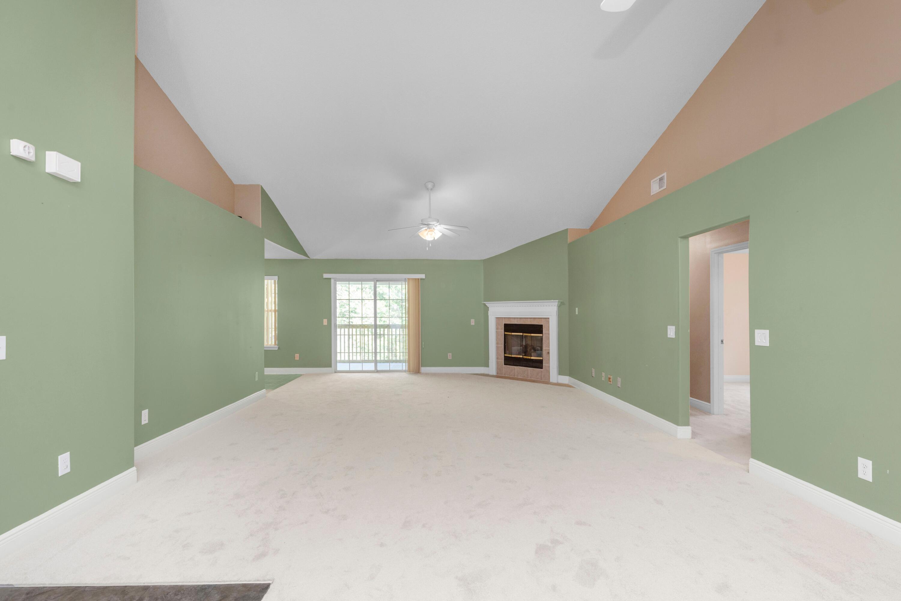 238 Foxchase Way Crestview, FL 32536 - Photo 7 of 33 a view of an empty room with window and wooden floor