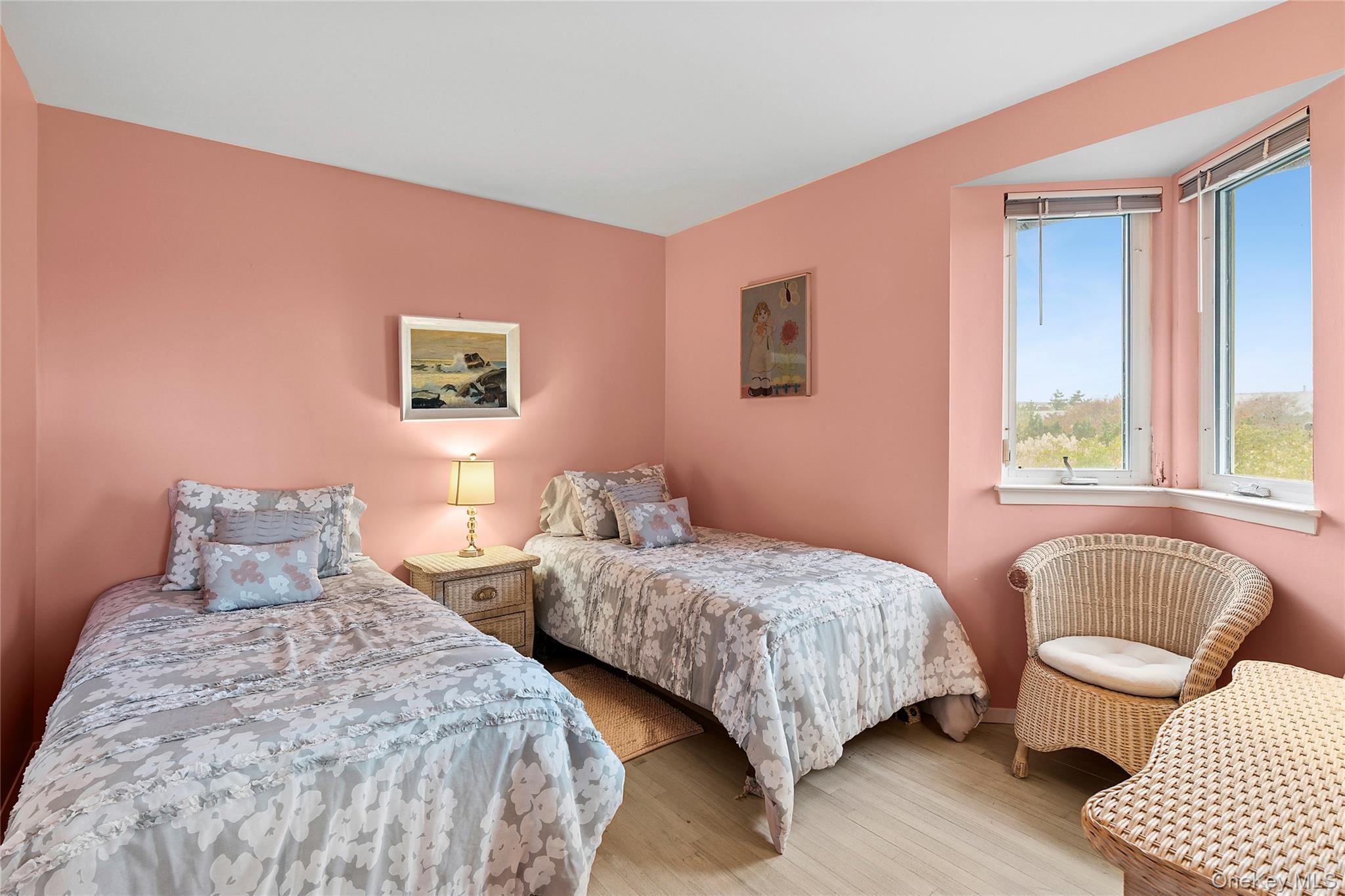 542 Dune Road Westhampton, NY 11978 - Photo 11 of 19 a bedroom with two beds and a couch