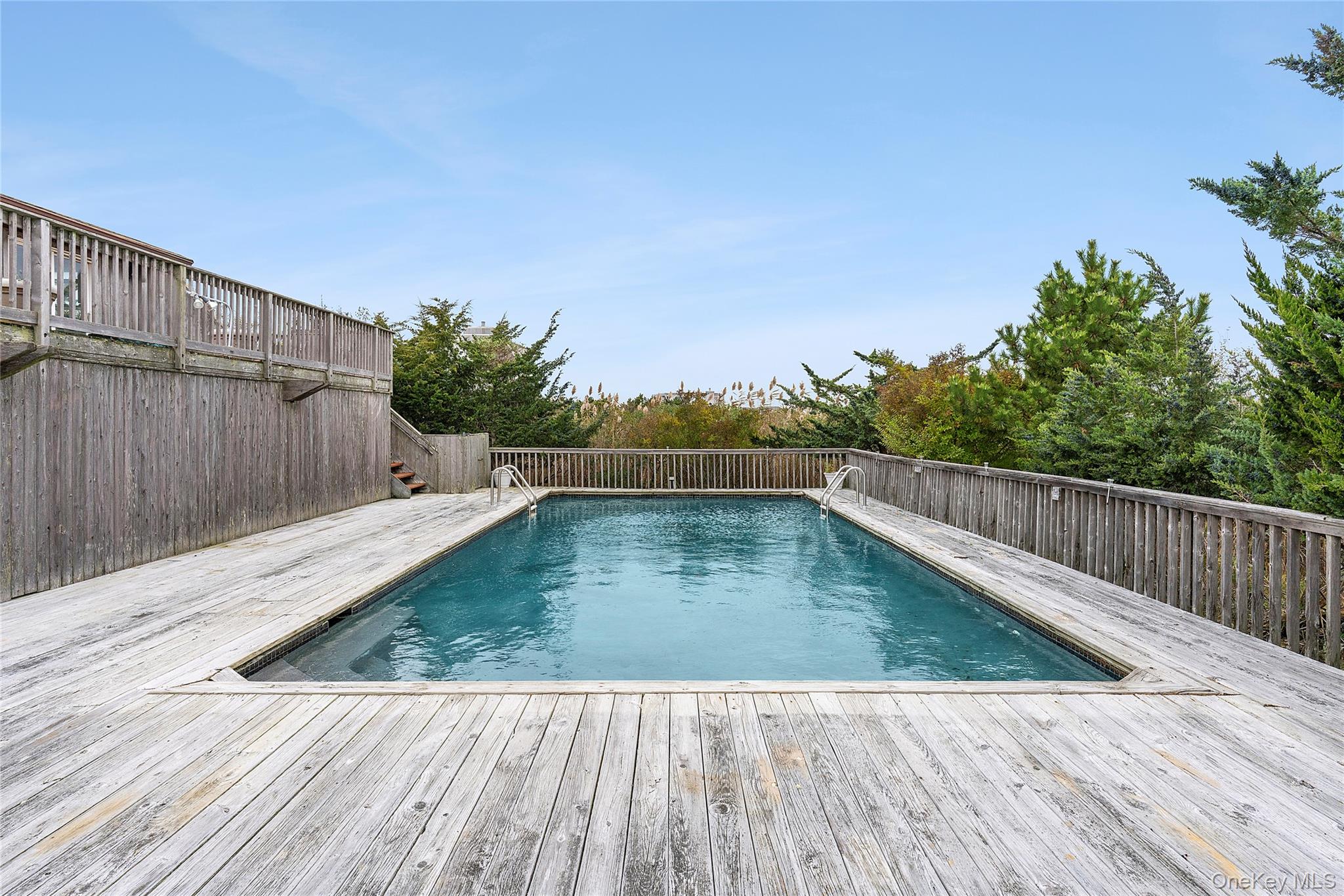 542 Dune Road Westhampton, NY 11978 - Photo 14 of 19 a view of a balcony with wooden floor