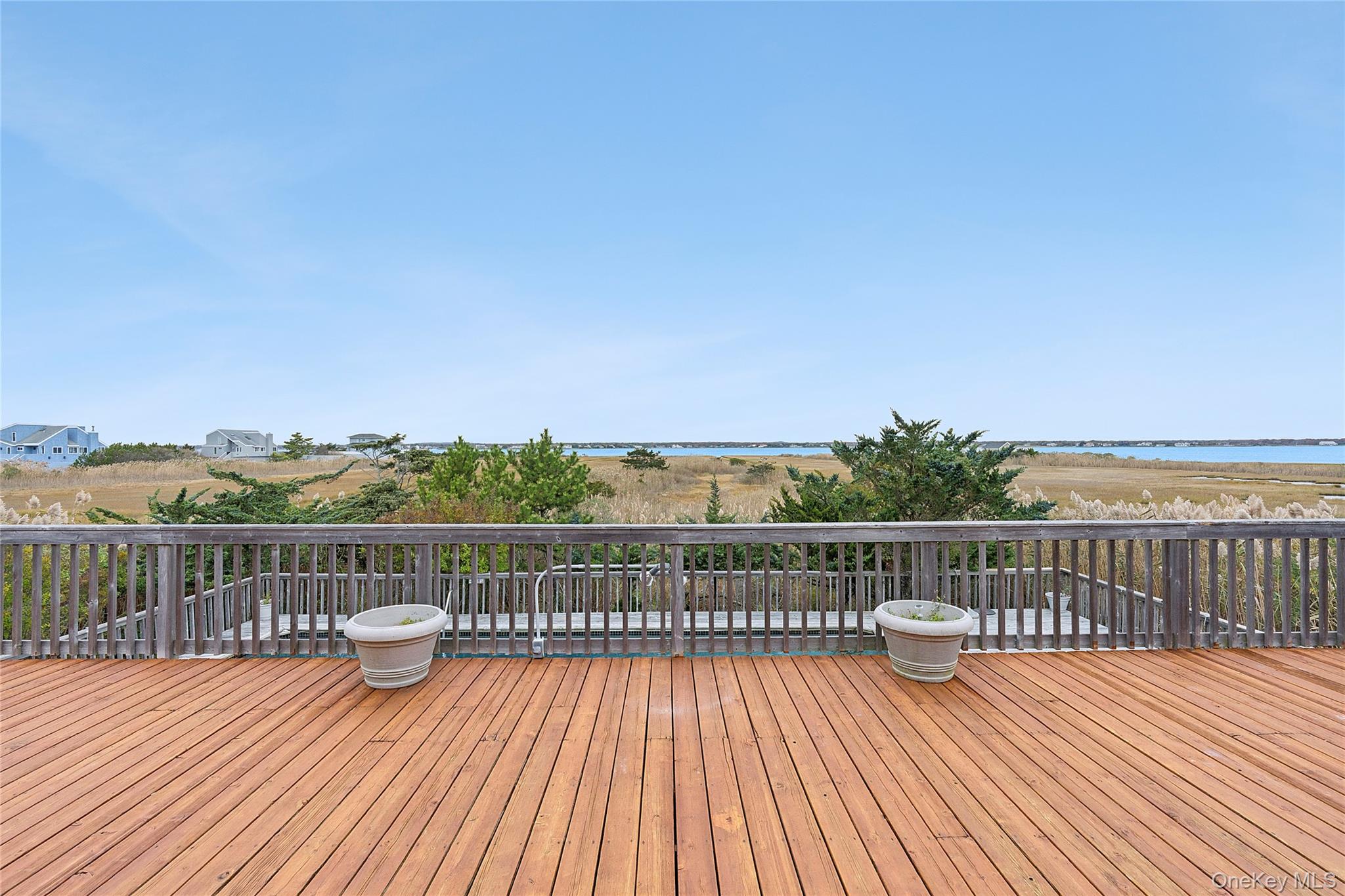 542 Dune Road Westhampton, NY 11978 - Photo 16 of 19 a view of deck with wooden floor and city view