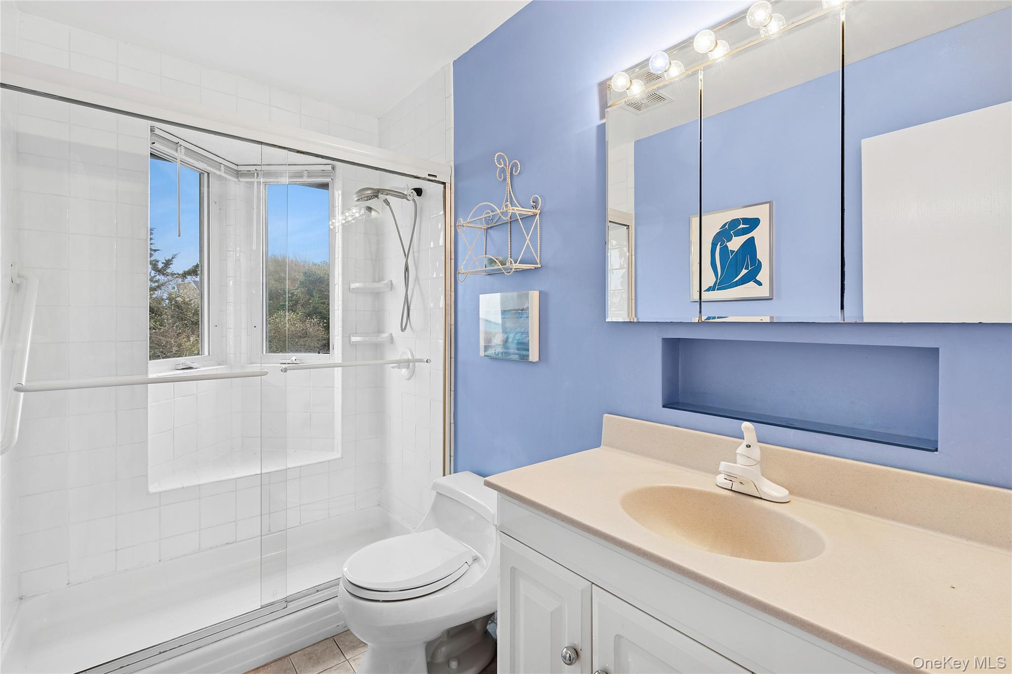 542 Dune Road Westhampton, NY 11978 - Photo 8 of 19 a bathroom with a sink toilet and shower