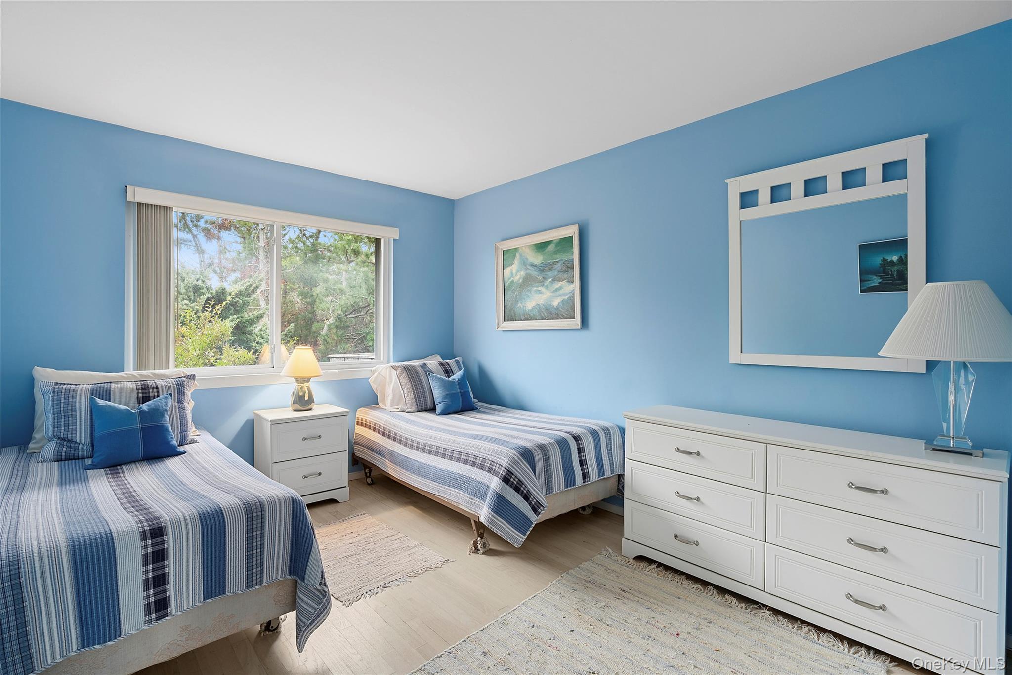 542 Dune Road Westhampton, NY 11978 - Photo 10 of 19 a bedroom with two beds and a dresser