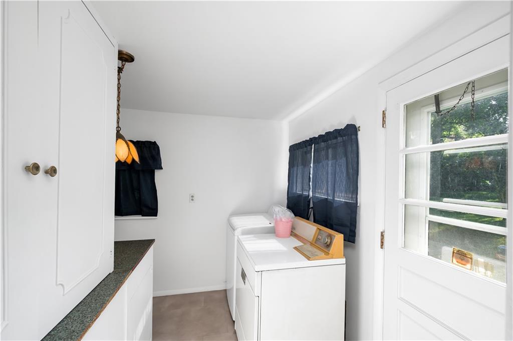 411 Harmony Road Baden, PA 15005 - Photo 19 of 25 a hallway with washer and dryer