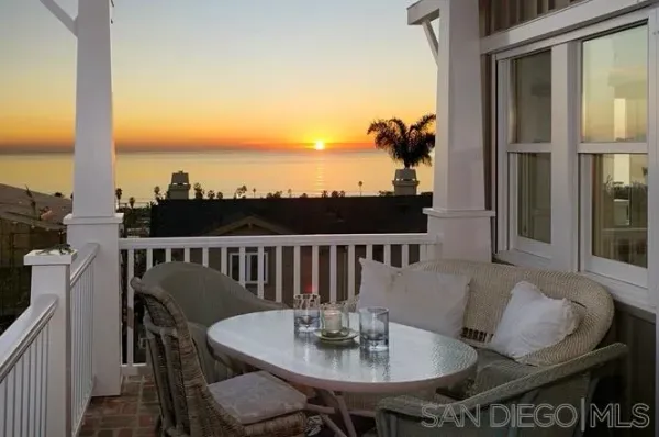a view of a balcony dining area and a couches