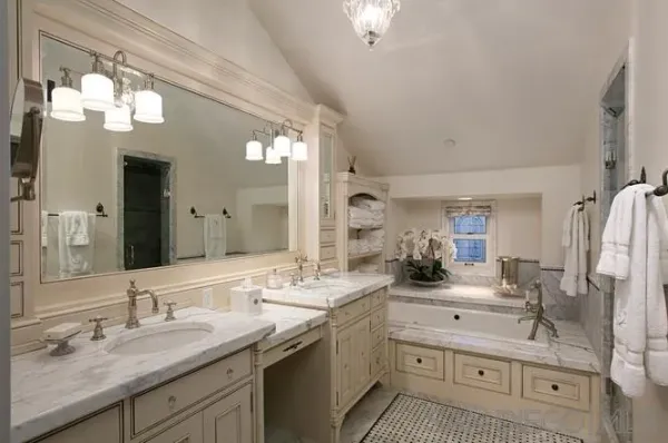 a bathroom with a double vanity sink mirror and
