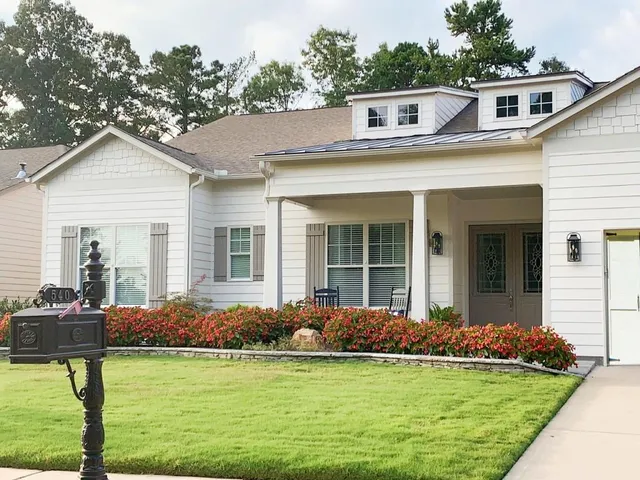 a view of a hallway with furniture and entryway