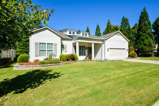 a work room with furniture and a potted plant
