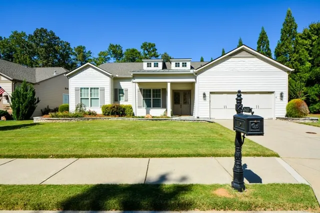 a dining room with furniture window and wooden floor