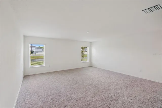 a bathroom with a granite countertop sink a toilet and a shower