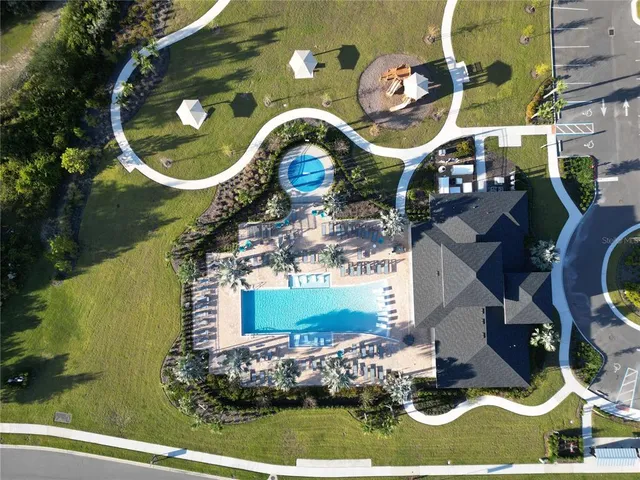 a view of a swimming pool with an outdoor space and seating area