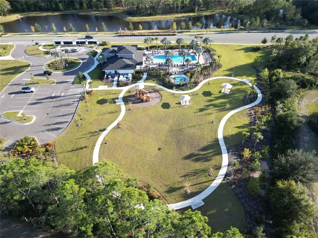 an aerial view of a swimming pool and outdoor space