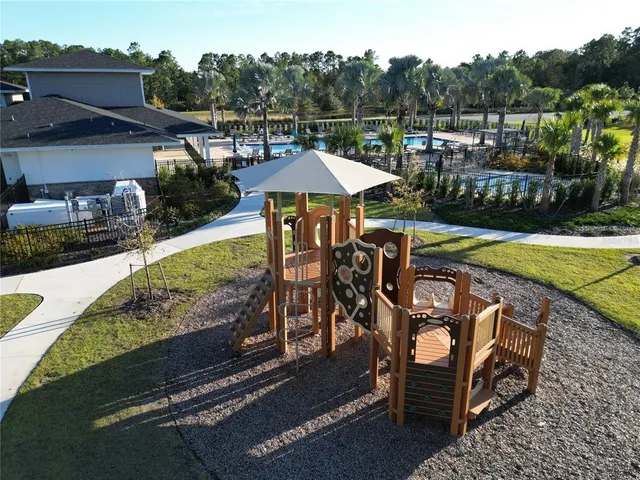 a view of a swimming pool with a patio