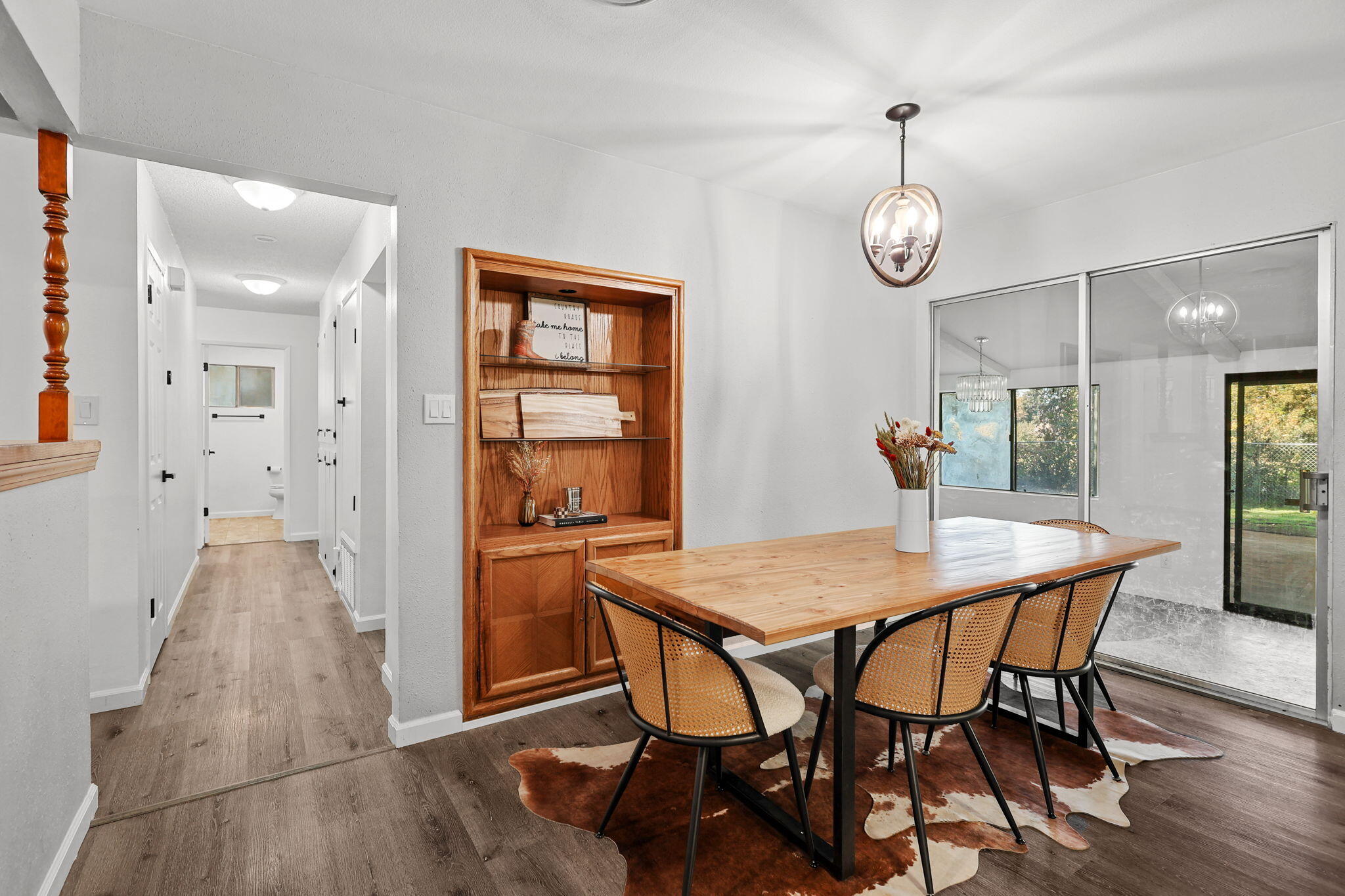 6958 Riverside Drive Redding, CA 96001 - Photo 12 of 30 a view of a dining room with furniture and window