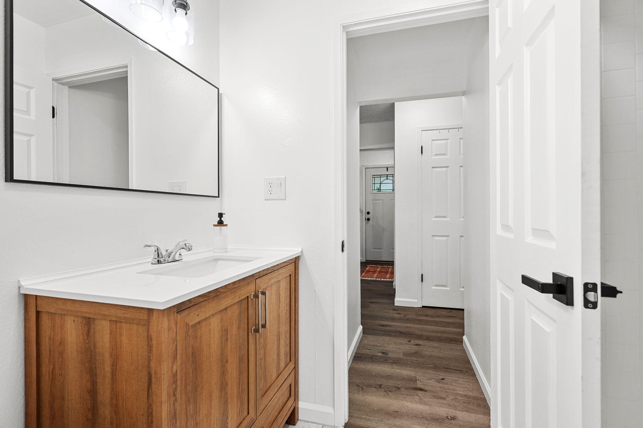 6958 Riverside Drive Redding, CA 96001 - Photo 17 of 30 a bathroom with a sink a mirror and a shower
