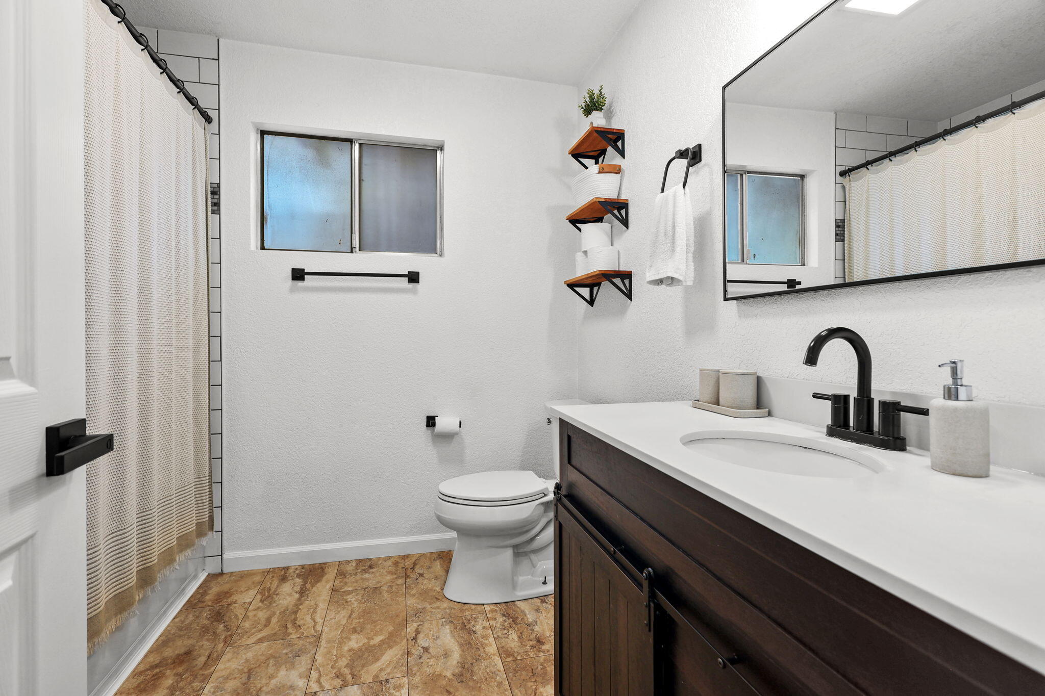 6958 Riverside Drive Redding, CA 96001 - Photo 21 of 30 a bathroom with a sink toilet and shower