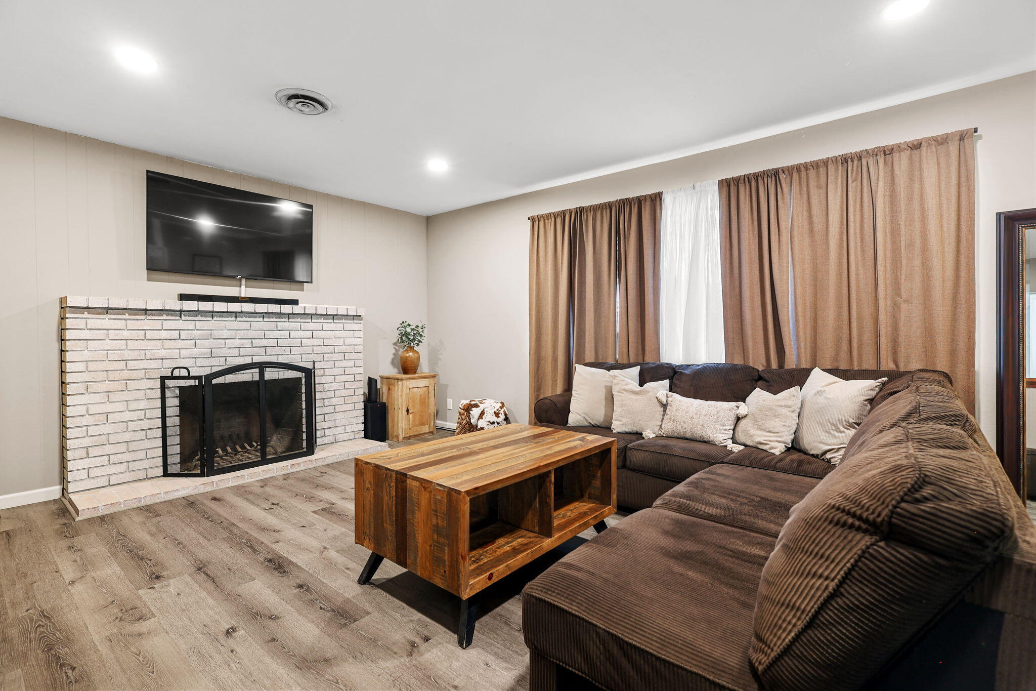 6958 Riverside Drive Redding, CA 96001 - Photo 5 of 30 a living room with furniture and a fireplace