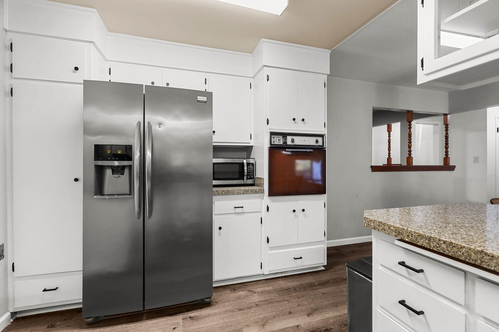 6958 Riverside Drive Redding, CA 96001 - Photo 10 of 30 a kitchen with stainless steel appliances granite countertop a refrigerator and a stove