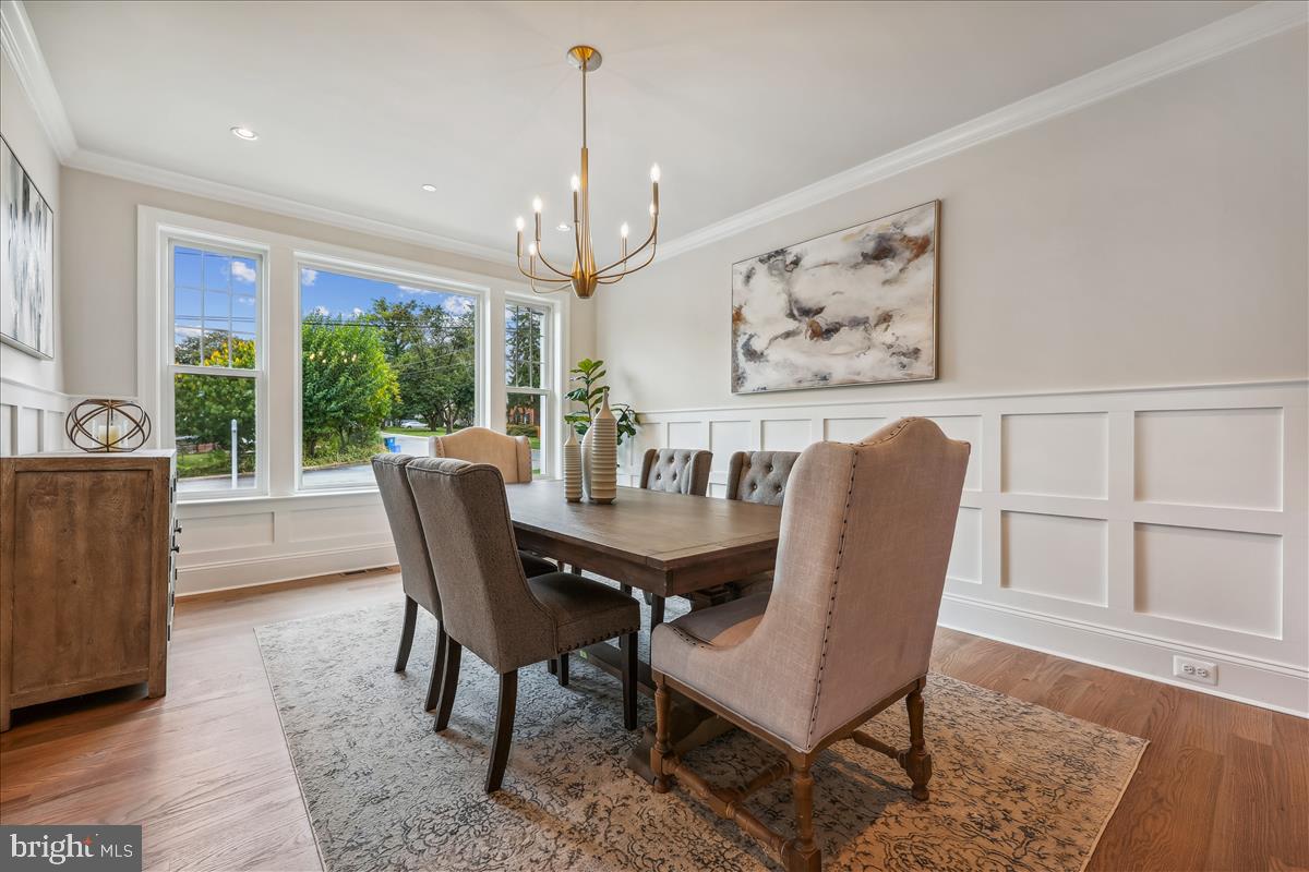 7600 Massena Road Bethesda, MD 20817 - Photo 13 of 102 a view of a dining room with furniture window and wooden floor