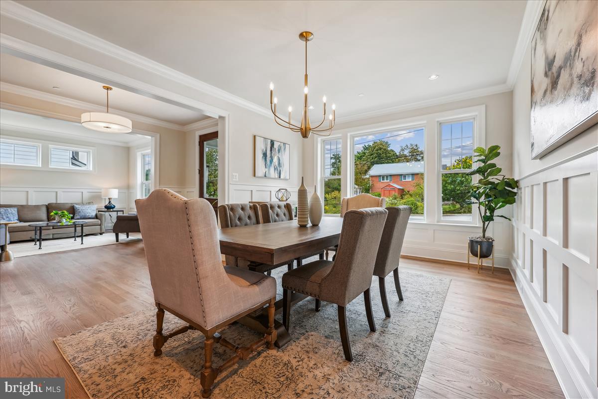 7600 Massena Road Bethesda, MD 20817 - Photo 14 of 102 a view of a dining room with furniture window and wooden floor