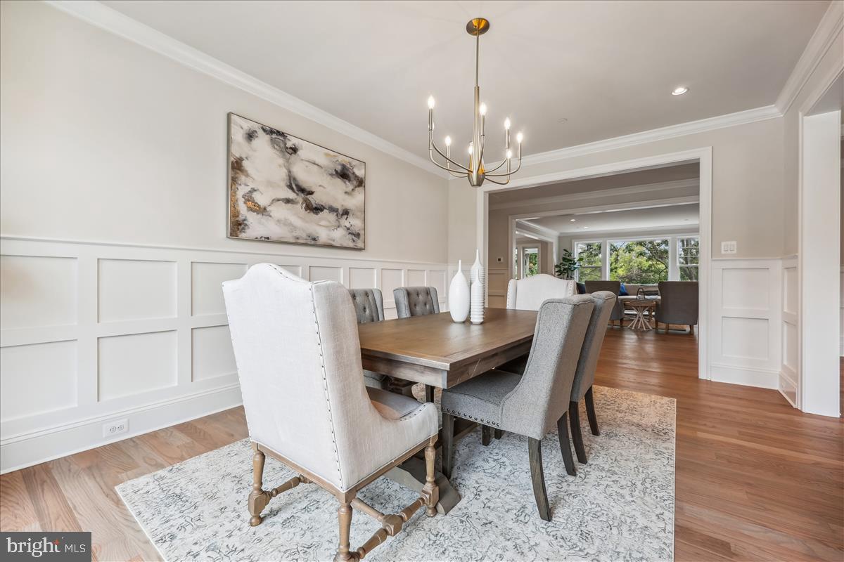 7600 Massena Road Bethesda, MD 20817 - Photo 15 of 102 a view of a dining room with furniture window and wooden floor