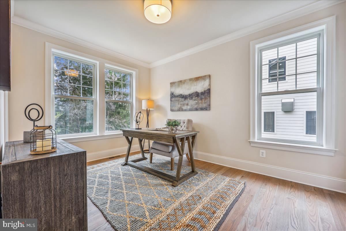 7600 Massena Road Bethesda, MD 20817 - Photo 16 of 102 a dining room with wooden floor and a window