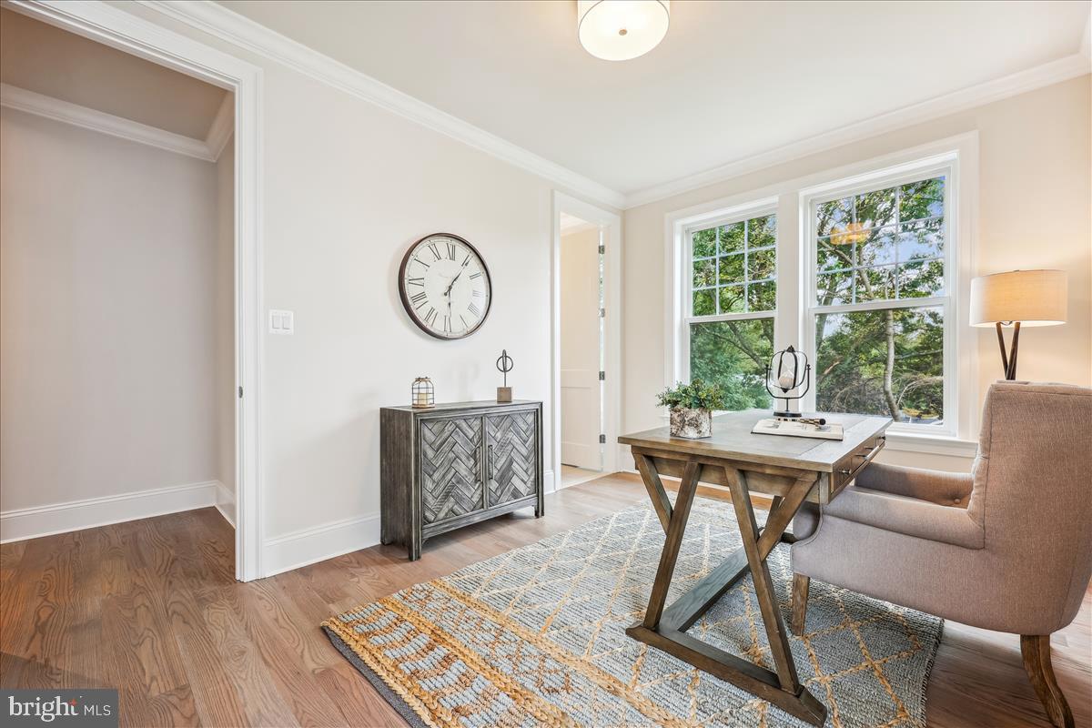 7600 Massena Road Bethesda, MD 20817 - Photo 17 of 102 a view of a dining room with furniture window and wooden floor