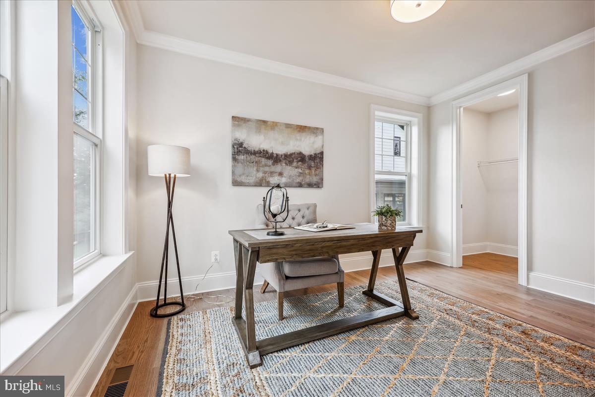 7600 Massena Road Bethesda, MD 20817 - Photo 18 of 102 a view of a workspace with furniture and wooden floor