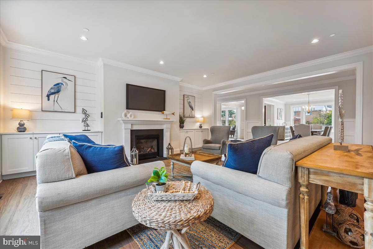 7600 Massena Road Bethesda, MD 20817 - Photo 23 of 102 a living room with furniture a fireplace and a flat screen tv