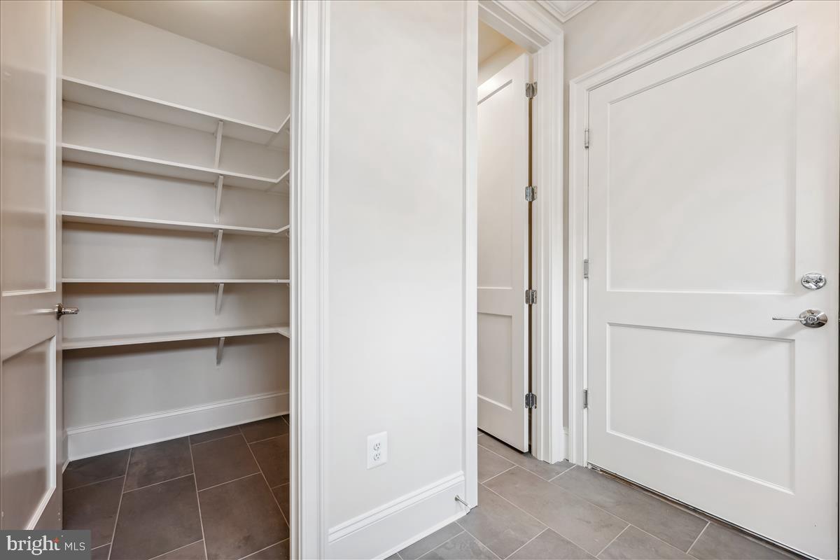 7600 Massena Road Bethesda, MD 20817 - Photo 33 of 102 a view of walk in closet with empty racks