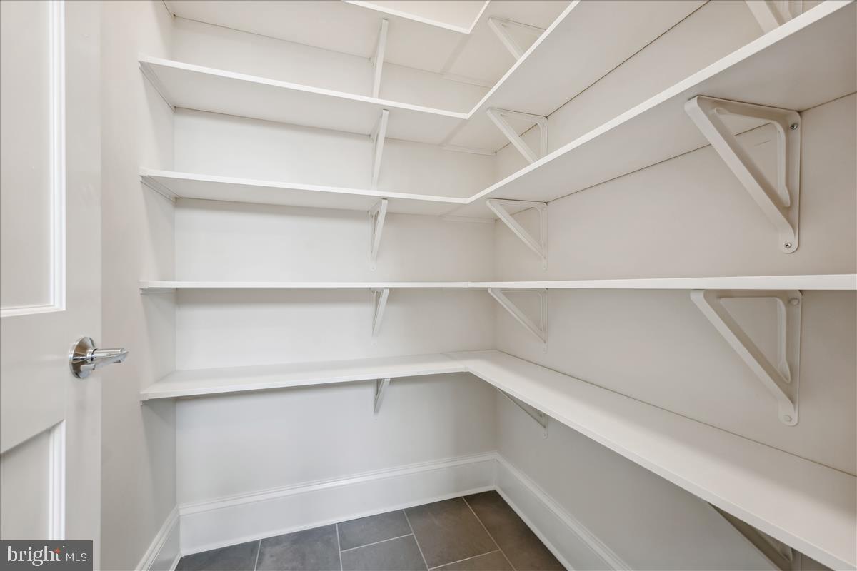7600 Massena Road Bethesda, MD 20817 - Photo 34 of 102 a view of walk in closet with empty racks