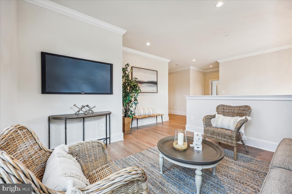 7600 Massena Road Bethesda, MD 20817 - Photo 48 of 102 a living room with furniture and a flat screen tv