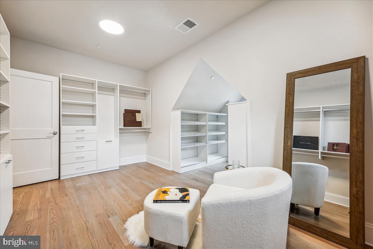 7600 Massena Road Bethesda, MD 20817 - Photo 61 of 102 a living room with furniture and a wooden floor