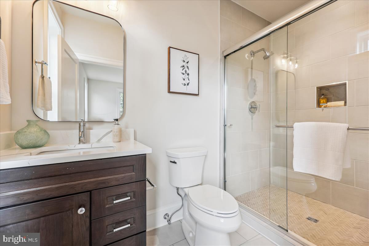 7600 Massena Road Bethesda, MD 20817 - Photo 65 of 102 a bathroom with a sink a toilet and shower
