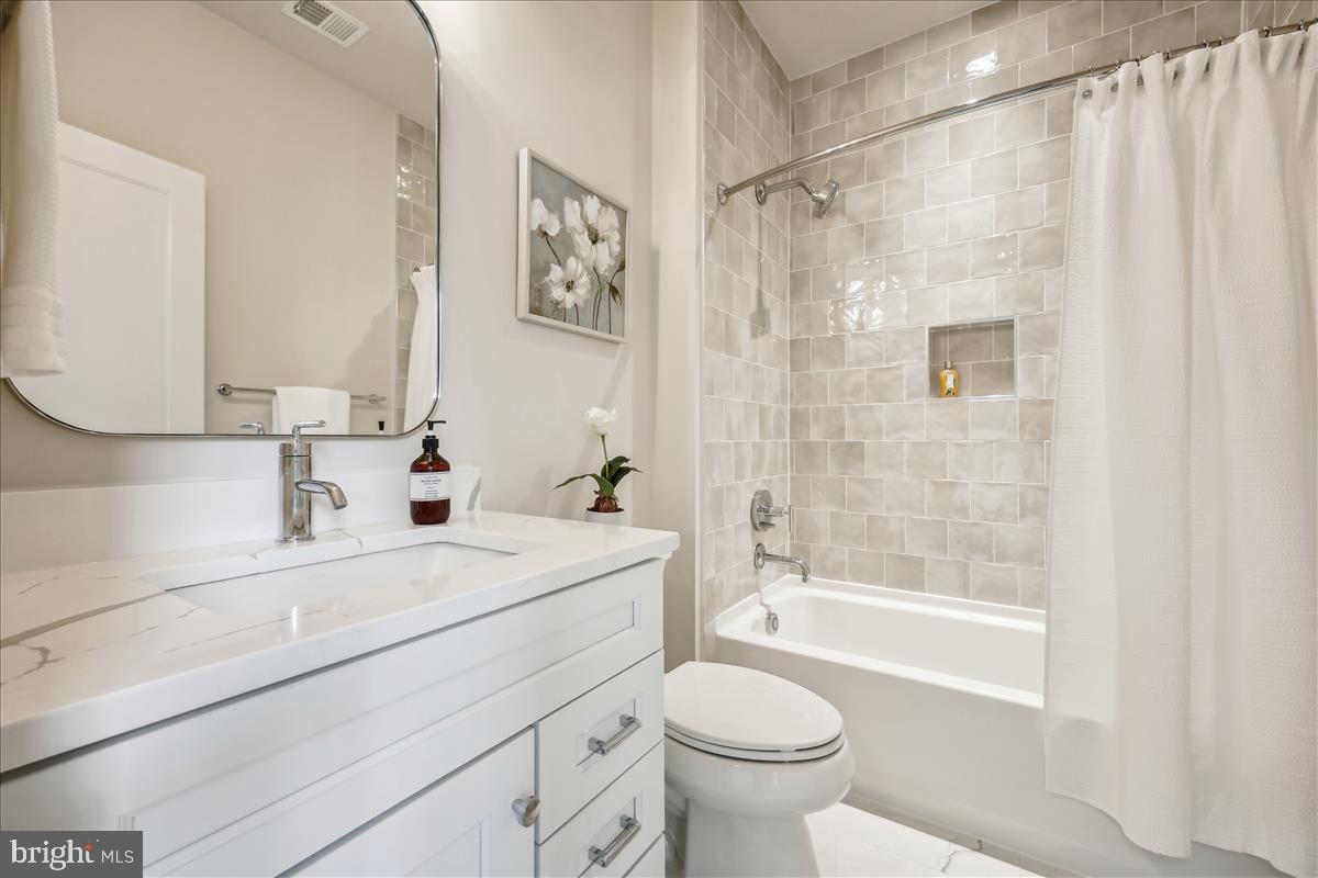 7600 Massena Road Bethesda, MD 20817 - Photo 73 of 102 a bathroom with a sink a toilet and shower