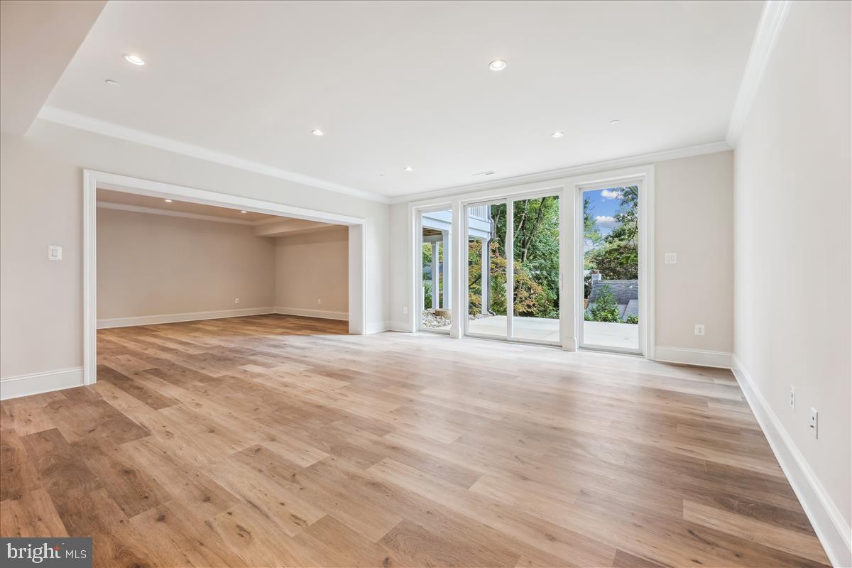 7600 Massena Road Bethesda, MD 20817 - Photo 92 of 102 a view of an empty room with wooden floor and windows