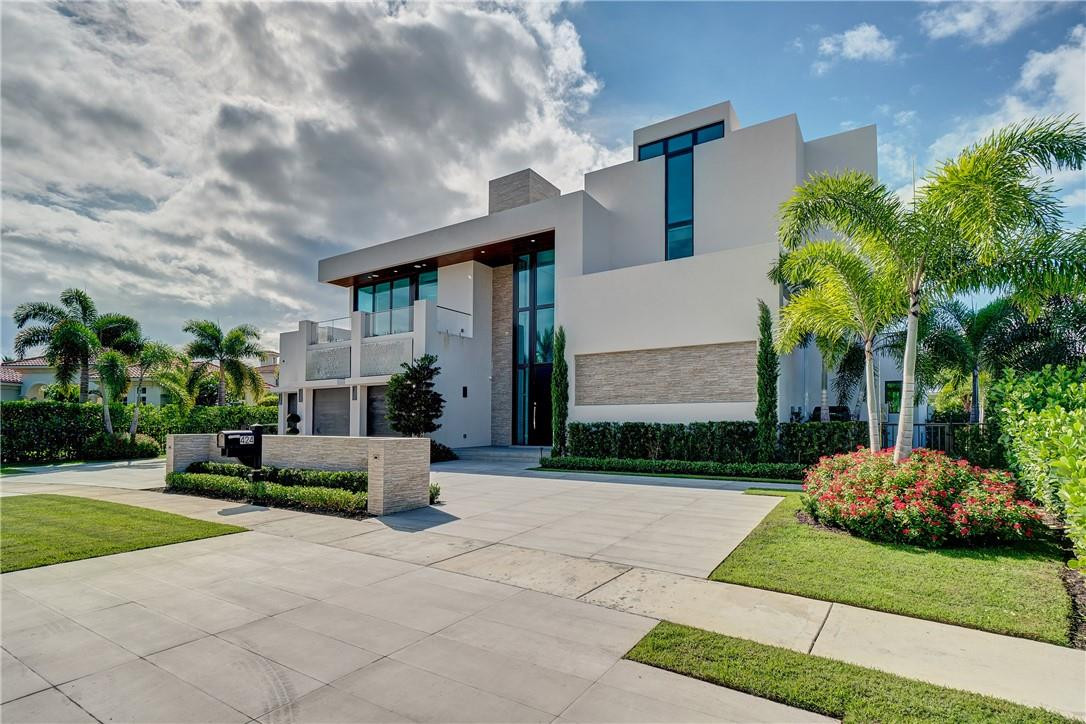 424 Northeast 5th Street Boca Raton, FL 33432 - Photo 2 of 51 a front view of a house with a garden and plants