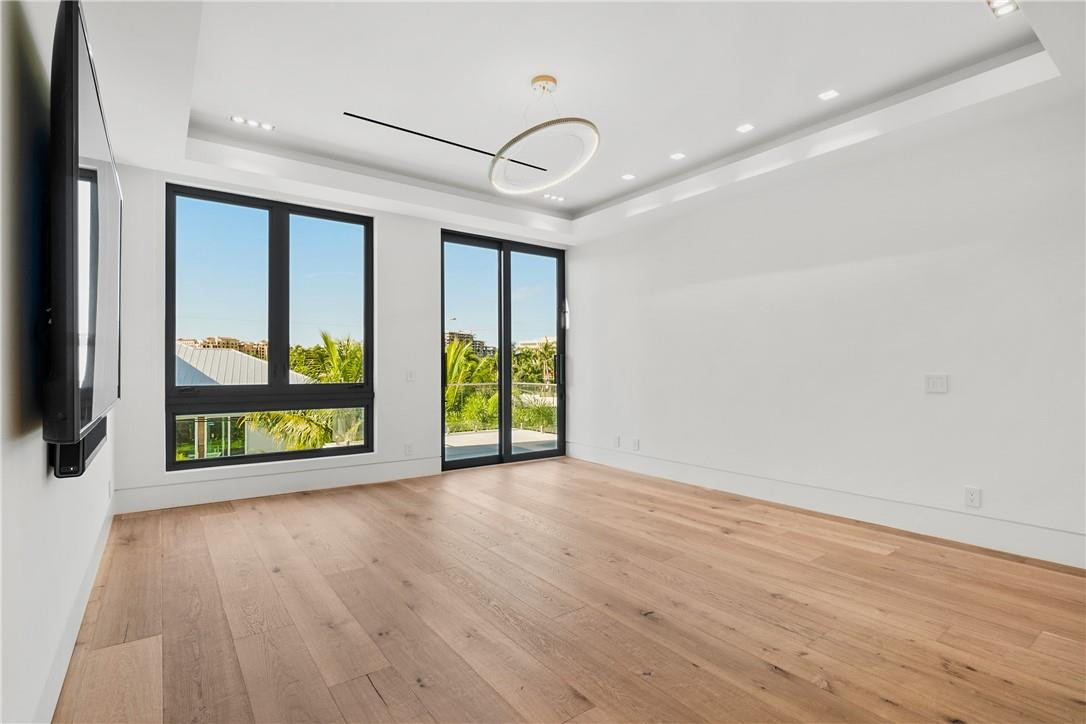424 Northeast 5th Street Boca Raton, FL 33432 - Photo 22 of 51 an empty room with wooden floor and windows