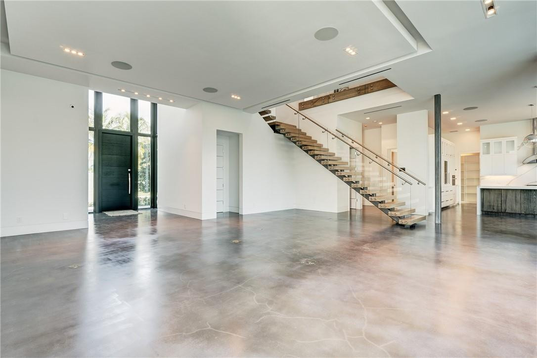 424 Northeast 5th Street Boca Raton, FL 33432 - Photo 4 of 51 an empty room with wooden floor and stairs