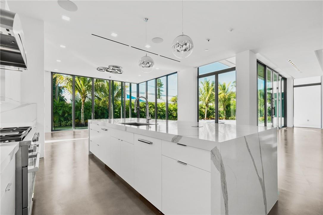 424 Northeast 5th Street Boca Raton, FL 33432 - Photo 10 of 51 a large white kitchen with a large window