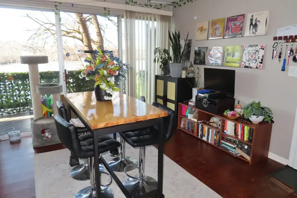a view of a dining room with furniture window and wooden floor