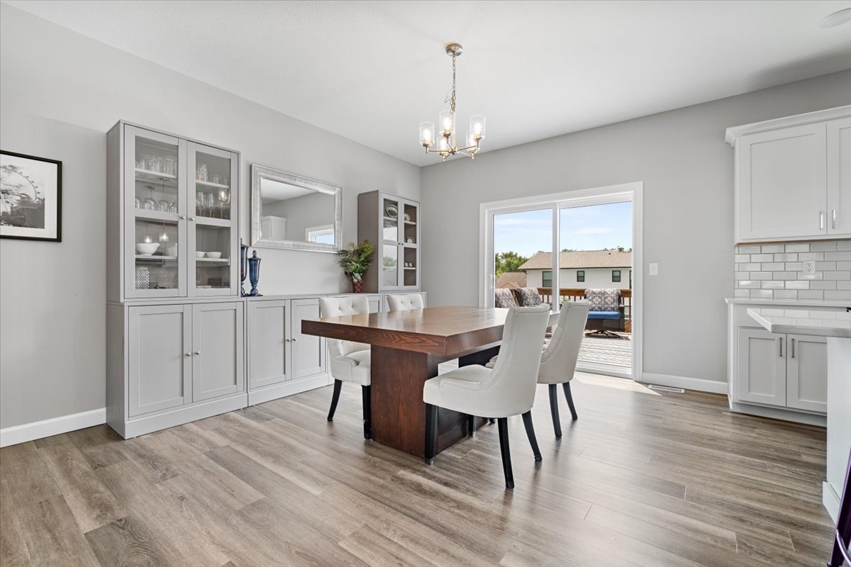 507 Raef Road Downs, IL 61736 - Photo 14 of 37 a view of a dining room with furniture and wooden floor