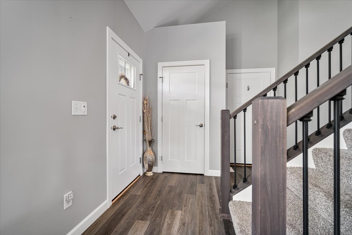 507 Raef Road Downs, IL 61736 - Photo 4 of 37 a view of hallway with wooden floor and stairs
