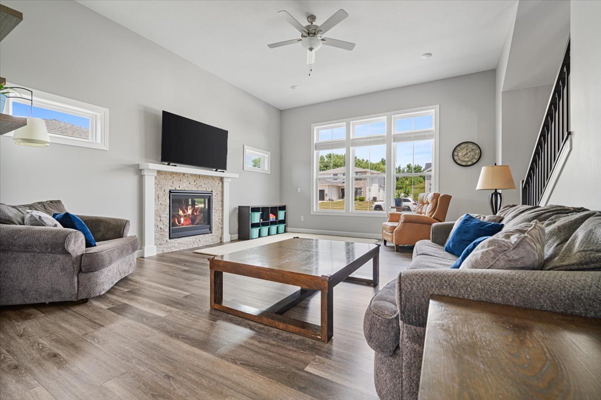 507 Raef Road Downs, IL 61736 - Photo 7 of 37 a living room with furniture a fireplace and a flat screen tv