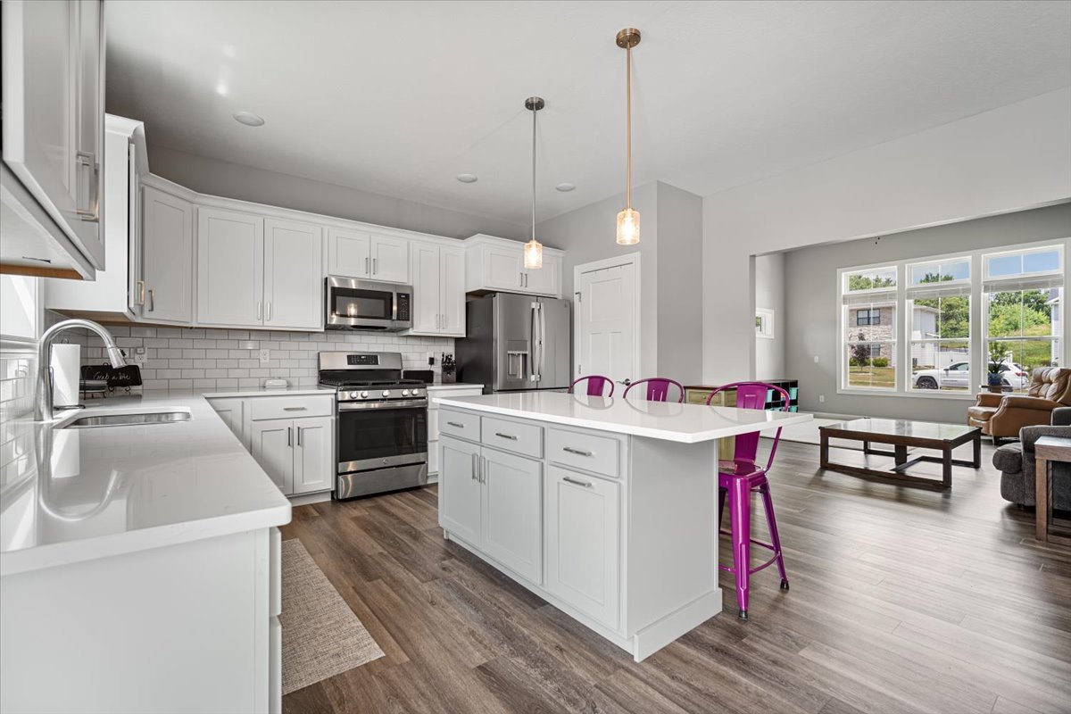 507 Raef Road Downs, IL 61736 - Photo 10 of 37 a kitchen with a sink stove and microwave