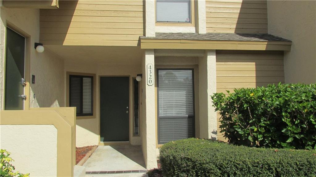a house view with a outdoor space