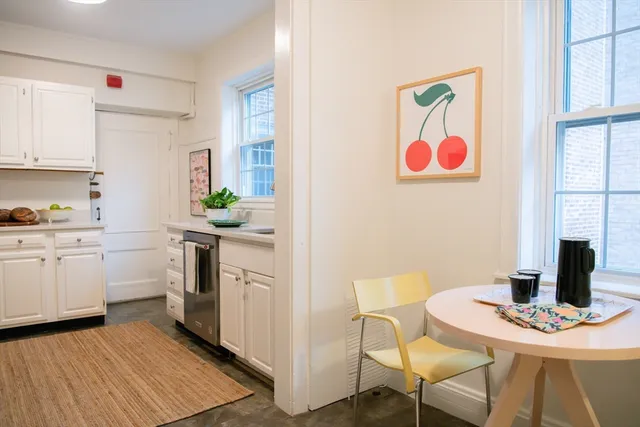 a room with wooden floor and furniture