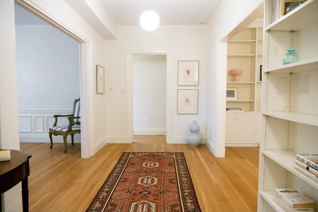 a bedroom with a bed and a lamp on table