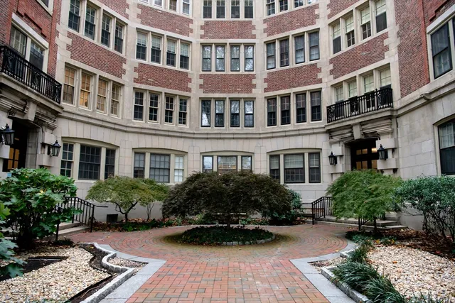 a kitchen with a refrigerator and a stove