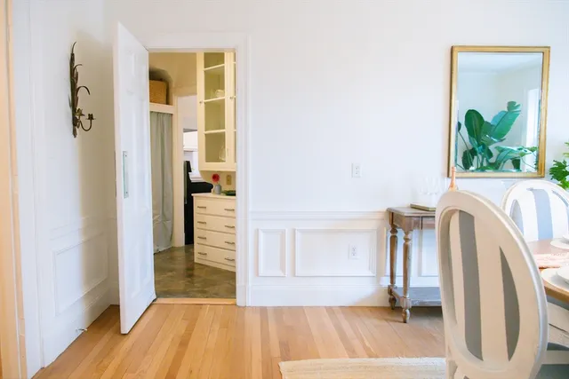 a kitchen with granite countertop white cabinets and window
