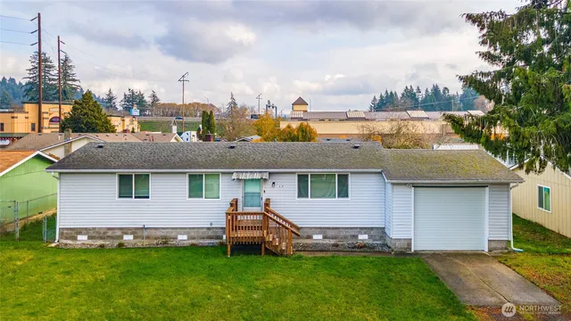 a aerial view of a house with a garden and deck